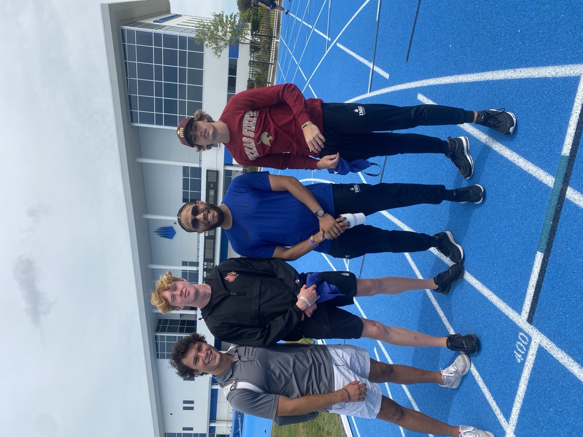 Cameron Winston with athletes on the track